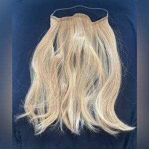 Daisy Fuentes secret halo hair extension.